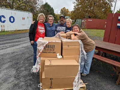 10.25.22 Volunteers with the tins